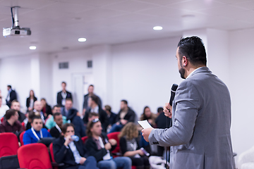 Image showing successful businessman giving presentations at conference room