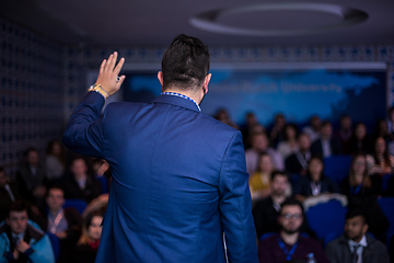 Image showing successful businessman giving presentations at conference room