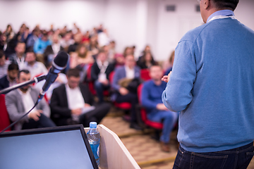 Image showing successful businessman giving presentations at conference room