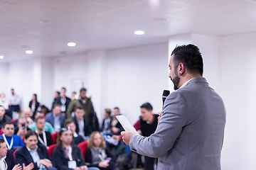 Image showing successful businessman giving presentations at conference room