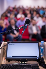 Image showing laptop computer and microphone at podium