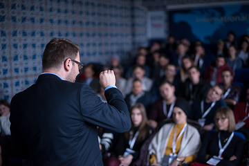 Image showing successful businessman giving presentations at conference room