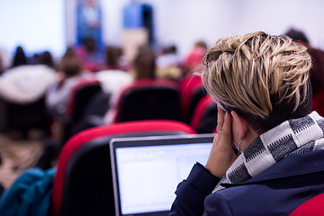 Image showing businesswoman using laptop computer during seminar