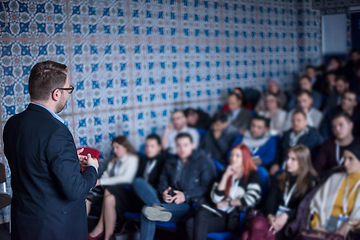 Image showing successful businessman giving presentations at conference room