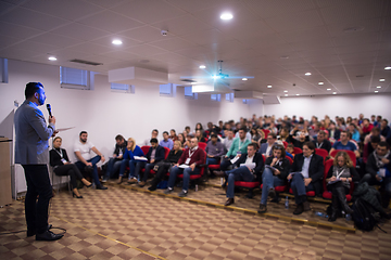 Image showing successful businessman giving presentations at conference room