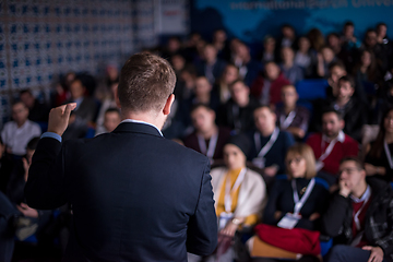 Image showing successful businessman giving presentations at conference room