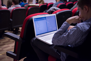 Image showing businessman using laptop computer during seminar