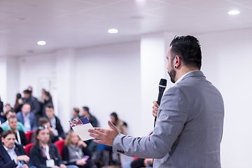 Image showing successful businessman giving presentations at conference room