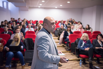 Image showing successful businessman giving presentations at conference room