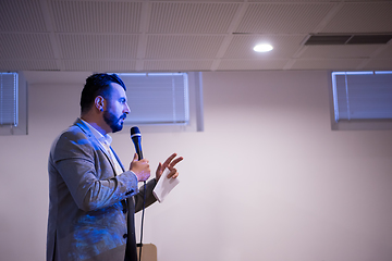 Image showing successful businessman giving presentations at conference room