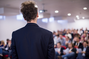 Image showing successful businessman giving presentations at conference room