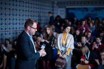 Image showing successful businessman giving presentations at conference room