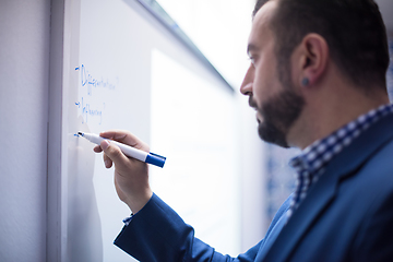 Image showing successful businessman giving presentations at conference room