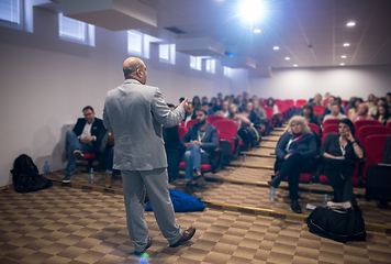 Image showing successful businessman giving presentations at conference room