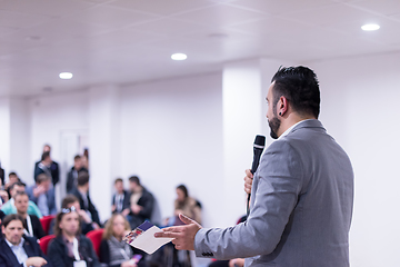 Image showing successful businessman giving presentations at conference room