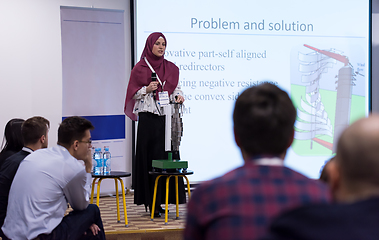 Image showing Muslim businesswoman giving presentations