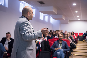 Image showing successful businessman giving presentations at conference room