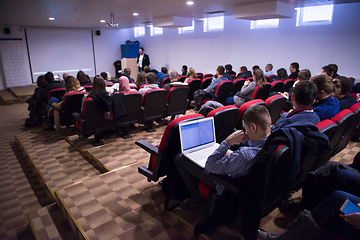 Image showing successful businessman giving presentations at conference room