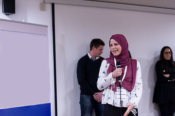 Image showing Muslim businesswoman giving presentations