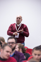 Image showing successful businessman giving presentations at conference room