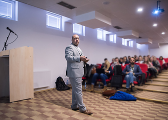 Image showing successful businessman giving presentations at conference room