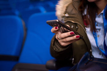 Image showing casual business woman hand using smart phone