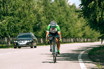 Image showing Dnipro, Ukraine - July 12, 2019: athlete with disabilities or amputee training in cycling