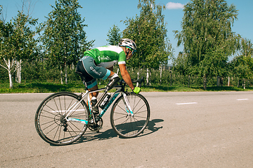 Image showing Dnipro, Ukraine - July 12, 2019: athlete with disabilities or amputee training in cycling