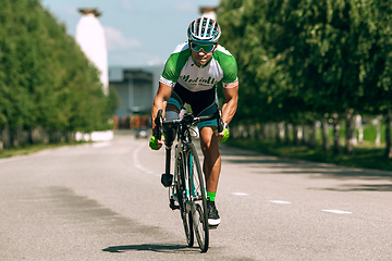 Image showing Dnipro, Ukraine - July 12, 2019: athlete with disabilities or amputee training in cycling