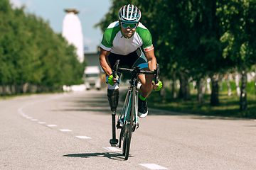 Image showing Athlete disabled amputee training in cycling