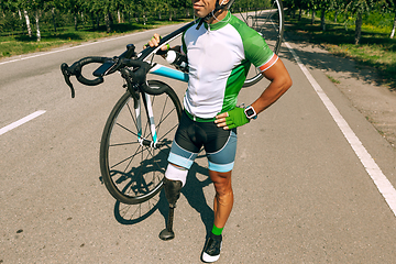 Image showing Athlete disabled amputee training in cycling