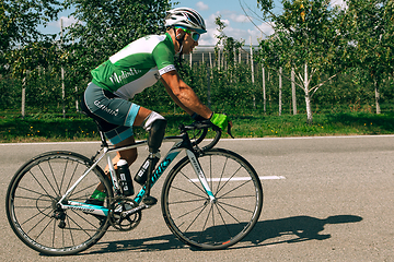 Image showing Dnipro, Ukraine - July 12, 2019: athlete with disabilities or amputee training in cycling