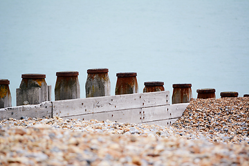 Image showing Wooden groynes to prevent coastal erosion in Eastbourne