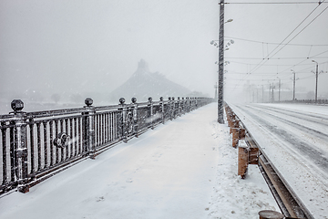 Image showing Snow covered bridge during heavy snow storm