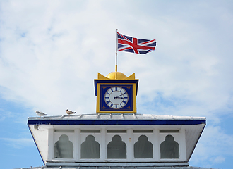 Image showing The Union Jack flag flies atop the clock tower of Eastbourne pie