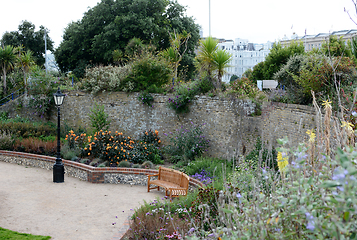 Image showing Attractive walled gardens full of flowers and shrubs around Wish