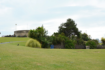 Image showing Grass slope with seating in front of historic Redoubt fortress i