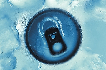 Image showing Aluminium tin can in fridge with ice closeup photo