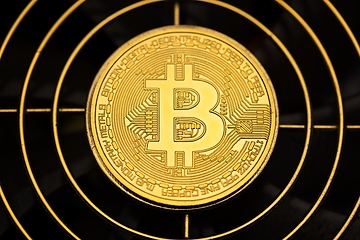 Image showing Physical shiny bitcoin agains dark background