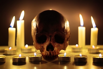 Image showing Human skull in candle light closeup