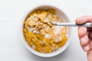 Image showing Eating bowl of cereals for breakfast closeup footage