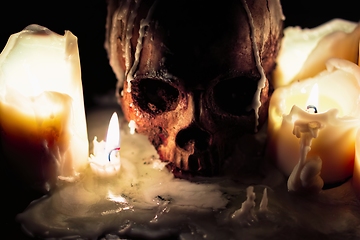 Image showing Human skull in candle light closeup