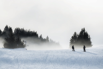 Image showing Foggy ski path with slopes