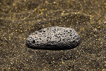 Image showing Smoke whirling around small meteorite stone