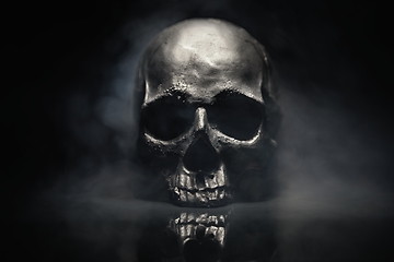 Image showing Spooky dark black skull aginast dark background