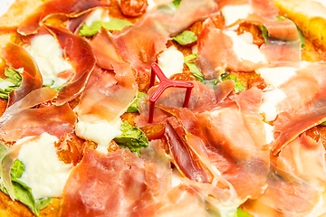 Image showing Delicious pizza surface with chease and meat