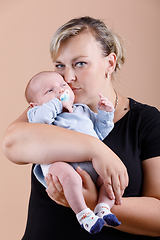 Image showing Loving mother embracing her baby