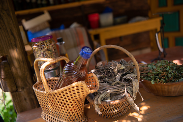 Image showing potion bottle in hand of herbalist