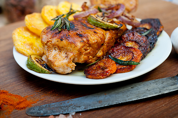 Image showing roasted grilled BBQ chicken breast with herbs and spices 