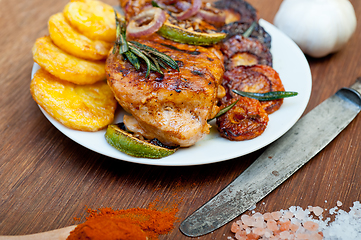 Image showing roasted grilled BBQ chicken breast with herbs and spices 
